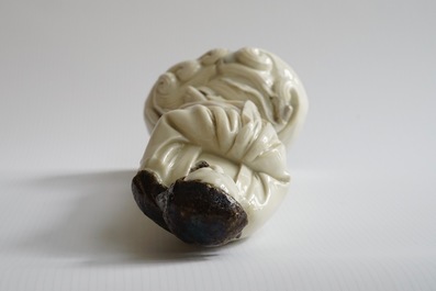 An unusual Chinese Dehua blanc de Chine figure of a black-scarved Luohan, 19th C.