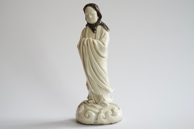 An unusual Chinese Dehua blanc de Chine figure of a black-scarved Luohan, 19th C.