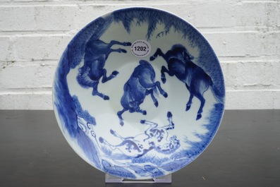 A Chinese blue and white conical bowl: "Horses of Mu Wang", Kangxi
