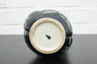 A Chinese famille noire lotus-shaped vase with applied dragons, 19th C.