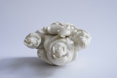 A Chinese Dehua blanc de Chine group of Wen Chang with 2 followers, 18/19th C.