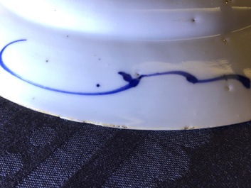 A Chinese blue and white plate after a Dutch Delft example, Qianlong, 18th C.