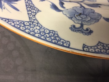 A massive blue and white Chinese charger with a punishment scene, Yongzheng/Qianlong