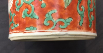 A Chinese famille verte coral-ground rouleau vase with peony scrolls, Kangxi