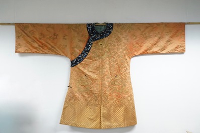 A Chinese orange ground silk embroidered dragon robe, 19th C.
