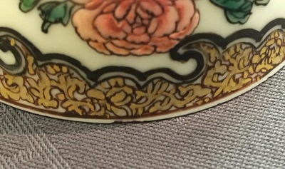 A Chinese famille rose eggshell cup and saucer with butterflies among flowers, Yongzheng, 1723-1735