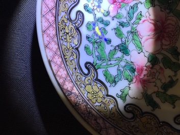 A Chinese famille rose eggshell cup and saucer with butterflies among flowers, Yongzheng, 1723-1735