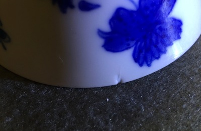 A pair of Chinese blue and white wine cups with 4 floral patterns, six-character mark, Kangxi
