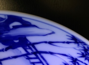 A Chinese blue and white plate with figures in a garden, Xuande mark, Yongzheng, 1723-1735