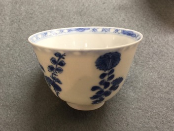 A pair of Chinese blue and white wine cups with 4 floral patterns, six-character mark, Kangxi