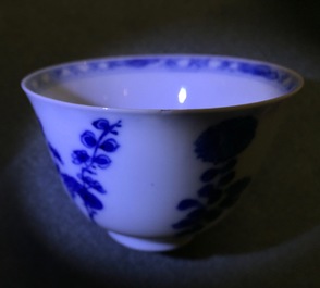 A pair of Chinese blue and white wine cups with 4 floral patterns, six-character mark, Kangxi