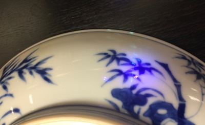 A Chinese blue and white plate with figures in a garden, Xuande mark, Yongzheng, 1723-1735