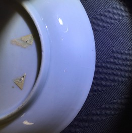 A Chinese famille rose eggshell cup and saucer with butterflies among flowers, Yongzheng, 1723-1735