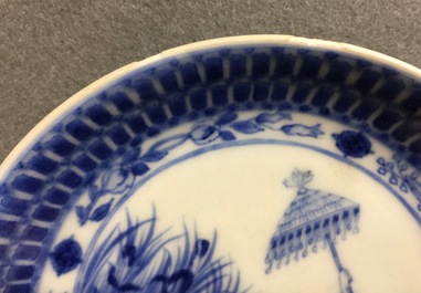A Chinese blue and white cup and saucer with "La Dame au Parasol" after Pronk, ca. 1740
