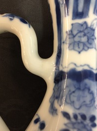 A small Chinese blue and white jug with a naked European, Kangxi