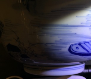 A Chinese blue and white bowl with a river scene, Kangxi