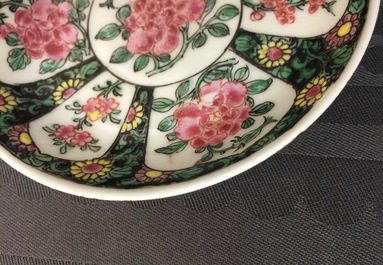 A Chinese famille noire cup and saucer, Yongzheng, 1723-1735