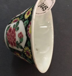 A Chinese famille noire cup and saucer, Yongzheng, 1723-1735