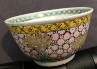 A Chinese famille rose eggshell cup and saucer with a central flowervase, Yongzheng, 1723-1735