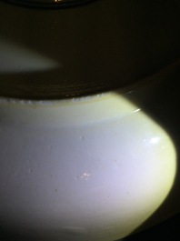 A rare Chinese famille verte caf&eacute; au lait ground landscape dish, Kangxi