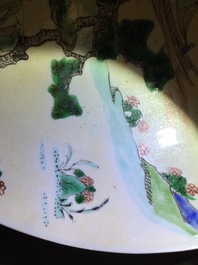 A rare Chinese famille verte caf&eacute; au lait ground landscape dish, Kangxi