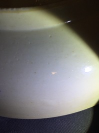 A rare Chinese famille verte caf&eacute; au lait ground landscape dish, Kangxi
