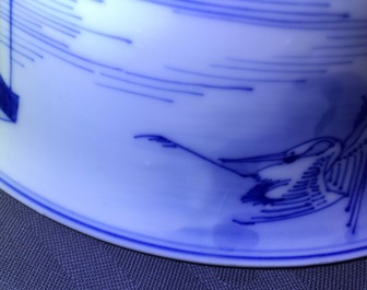 A Chinese blue and white bowl with a river scene, Kangxi