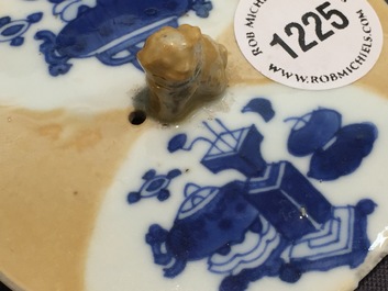 A Chinese blue and white on caf&eacute; au lait ground teapot and cover, Kangxi