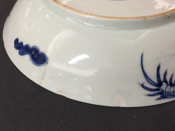 A large Chinese blue and white floral charger and two plates, Kangxi