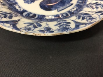 A large Chinese blue and white floral charger and two plates, Kangxi