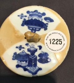 A Chinese blue and white on caf&eacute; au lait ground teapot and cover, Kangxi