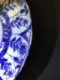 A large Chinese blue and white floral charger and two plates, Kangxi