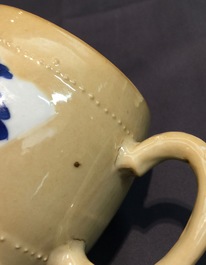A Chinese blue and white on caf&eacute; au lait ground teapot and cover, Kangxi