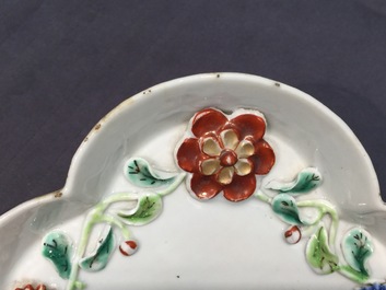 A Chinese moulded and applied famille rose teapot and cover on stand, Yongzheng, 1723-1735