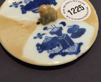 A Chinese blue and white on caf&eacute; au lait ground teapot and cover, Kangxi