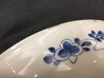 A large Chinese blue and white floral charger and two plates, Kangxi