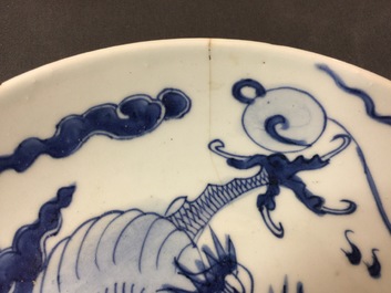 A large Chinese blue and white floral charger and two plates, Kangxi