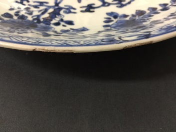 A large Chinese blue and white floral charger and two plates, Kangxi