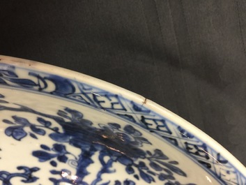 A large Chinese blue and white floral charger and two plates, Kangxi