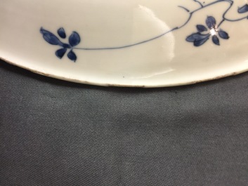 A large Chinese blue and white floral charger and two plates, Kangxi