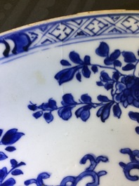 A large Chinese blue and white floral charger and two plates, Kangxi