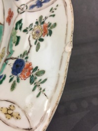 A large Chinese famille verte dish with a botanical garden, Kangxi