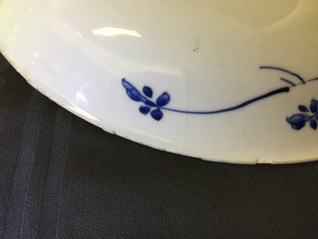 A large Chinese blue and white floral charger and two plates, Kangxi