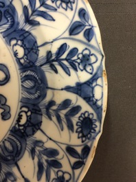 A large Chinese blue and white floral charger and two plates, Kangxi