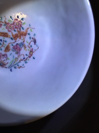 A Chinese relief-decorated famille rose cup and saucer with squirrels, Yongzheng, 1723-1735