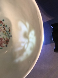 A Chinese relief-decorated famille rose cup and saucer with squirrels, Yongzheng, 1723-1735