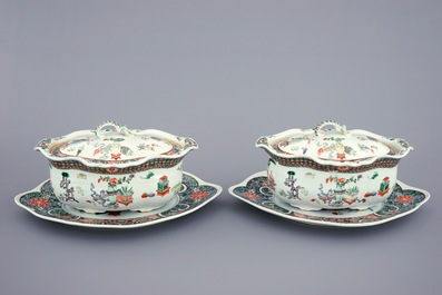 A pair of Chinese famille verte tureens and covers on stands, 19th C.