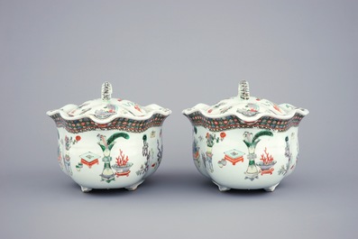 A pair of Chinese famille verte tureens and covers on stands, 19th C.