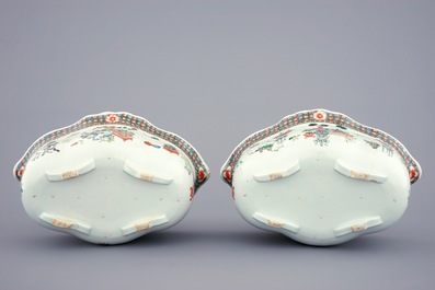 A pair of Chinese famille verte tureens and covers on stands, 19th C.