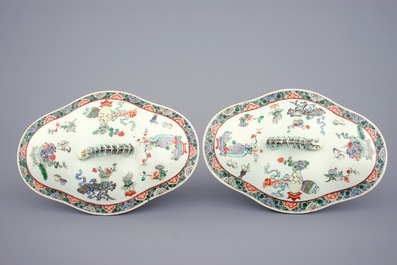 A pair of Chinese famille verte tureens and covers on stands, 19th C.